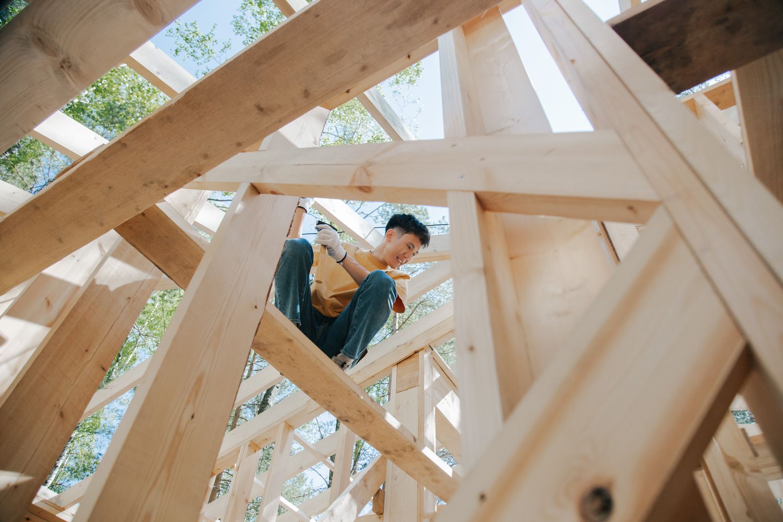 Worker framing a wood structure on a residential site